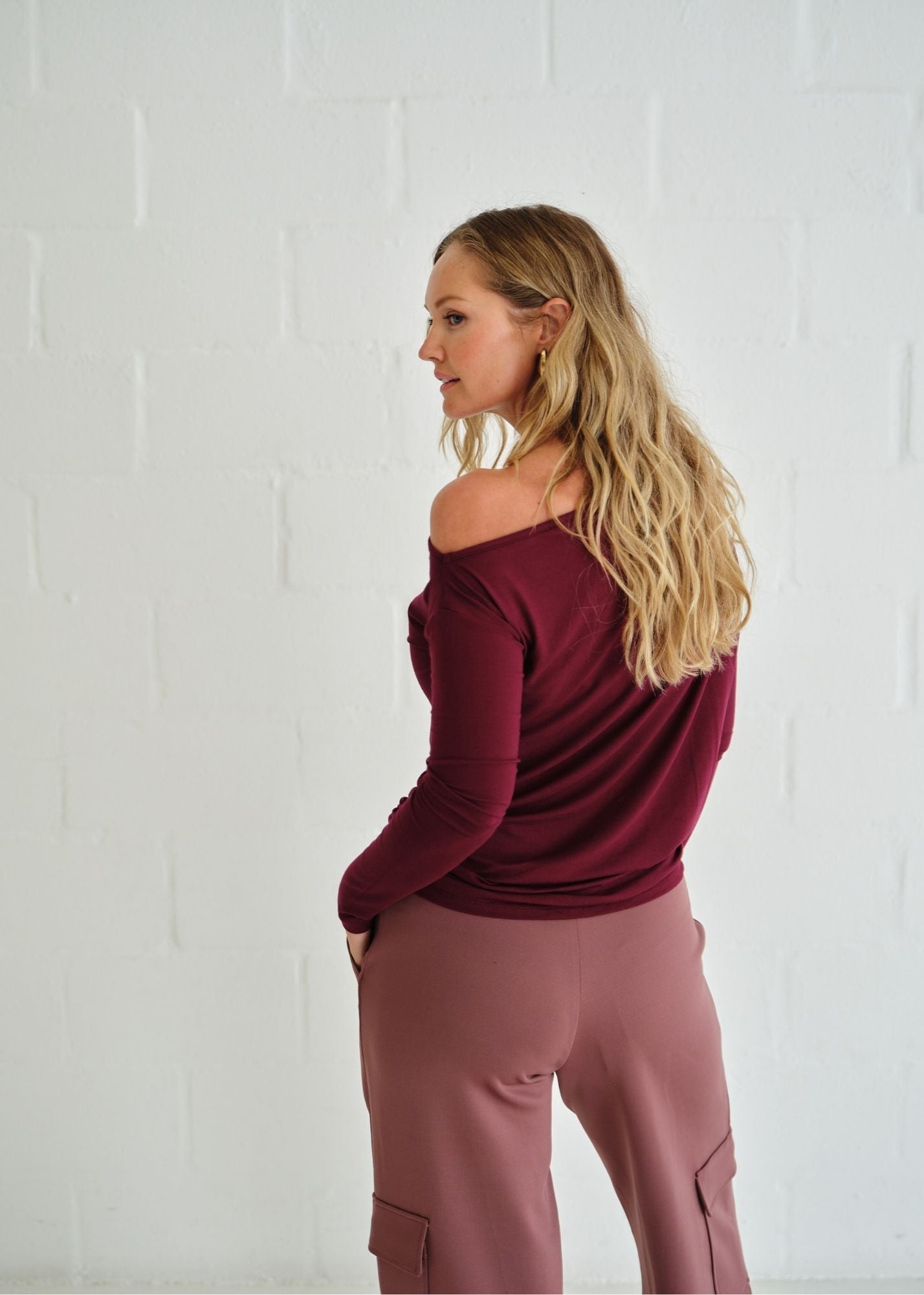 View our Long Sleeved Off The Shoulder Classic Top In Burgundy - by Tribute Store