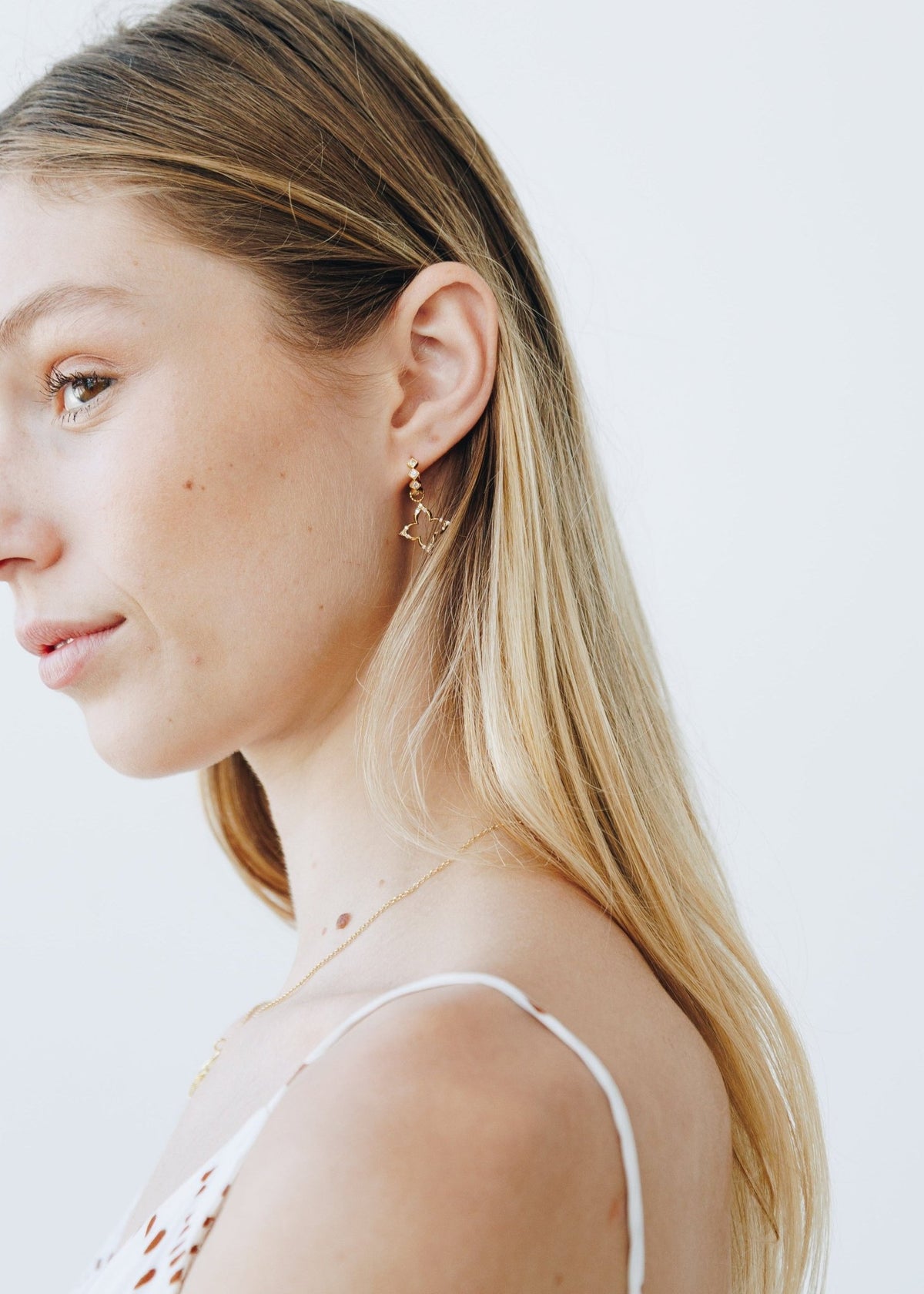 View our Lucky Sparkle Clover Gold Huggie Earrings - by Tribute Store