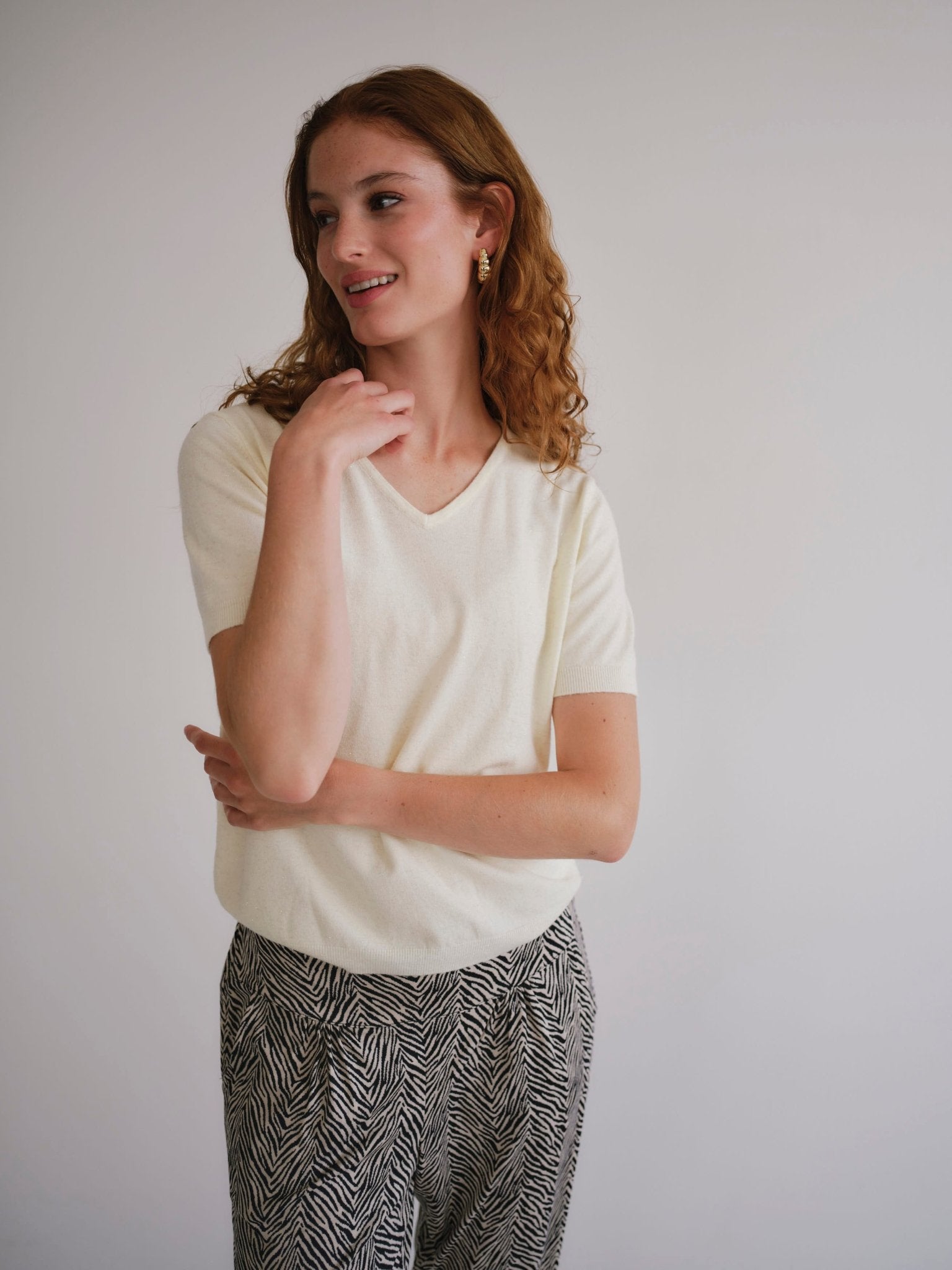 View our Lurex V Neck Tee with Shimmer Detail in Cream - by Tribute Store