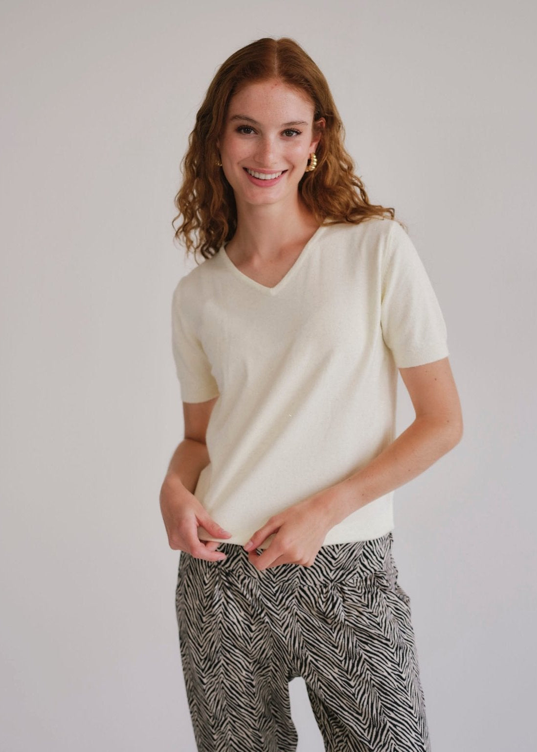 View our Lurex V Neck Tee with Shimmer Detail in Cream - by Tribute Store