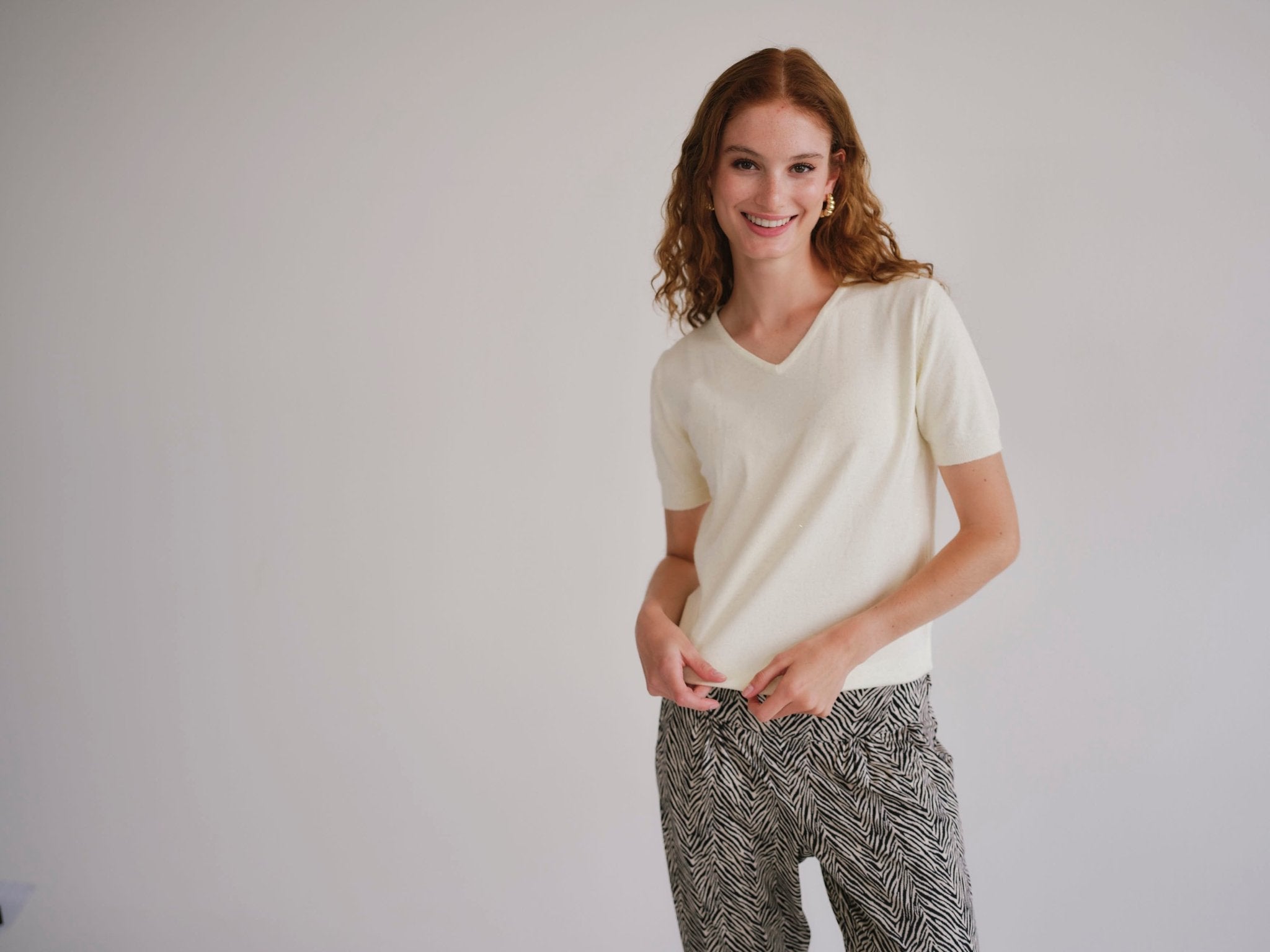 View our Lurex V Neck Tee with Shimmer Detail in Cream - by Tribute Store