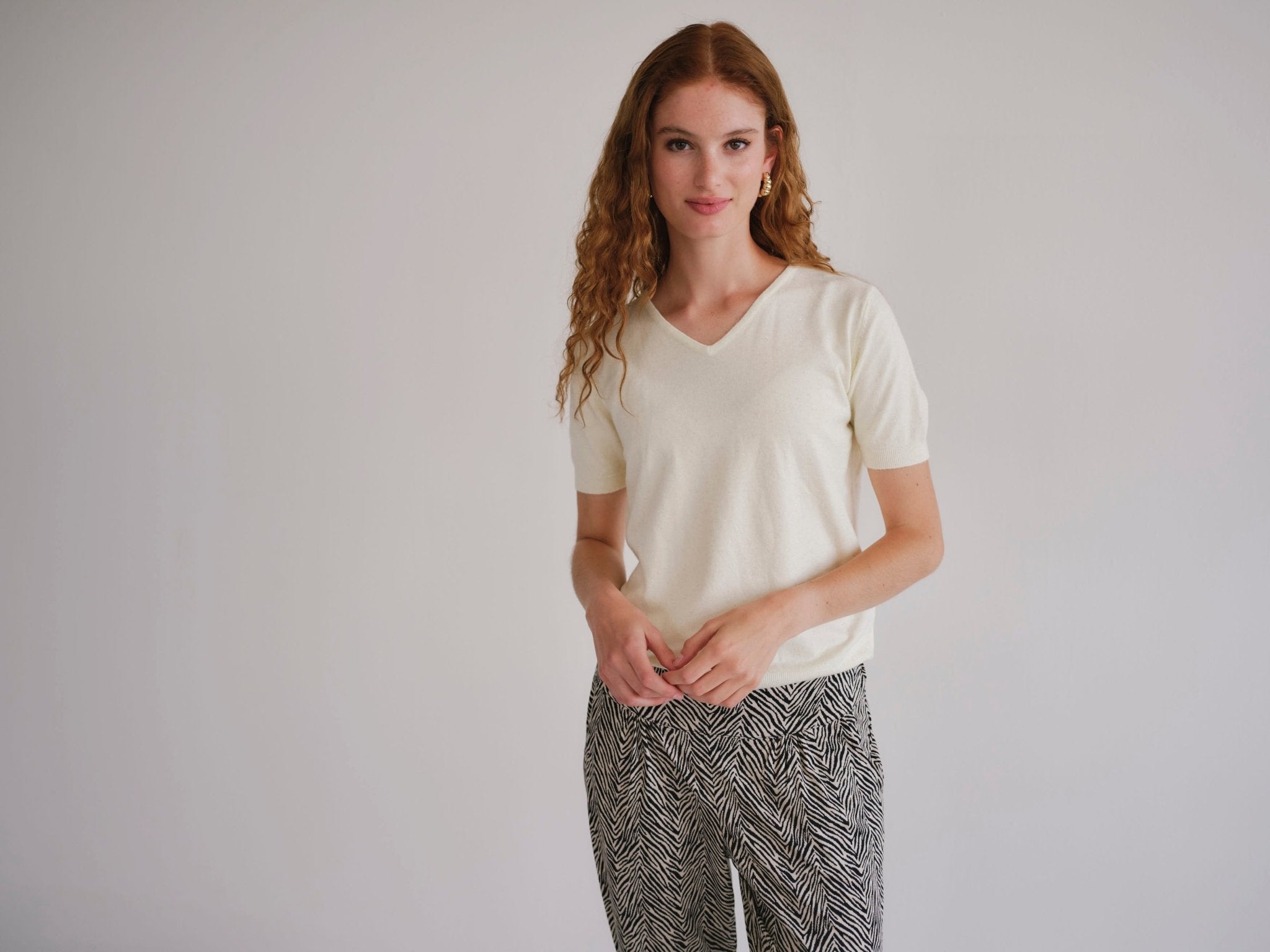 View our Lurex V Neck Tee with Shimmer Detail in Cream - by Tribute Store