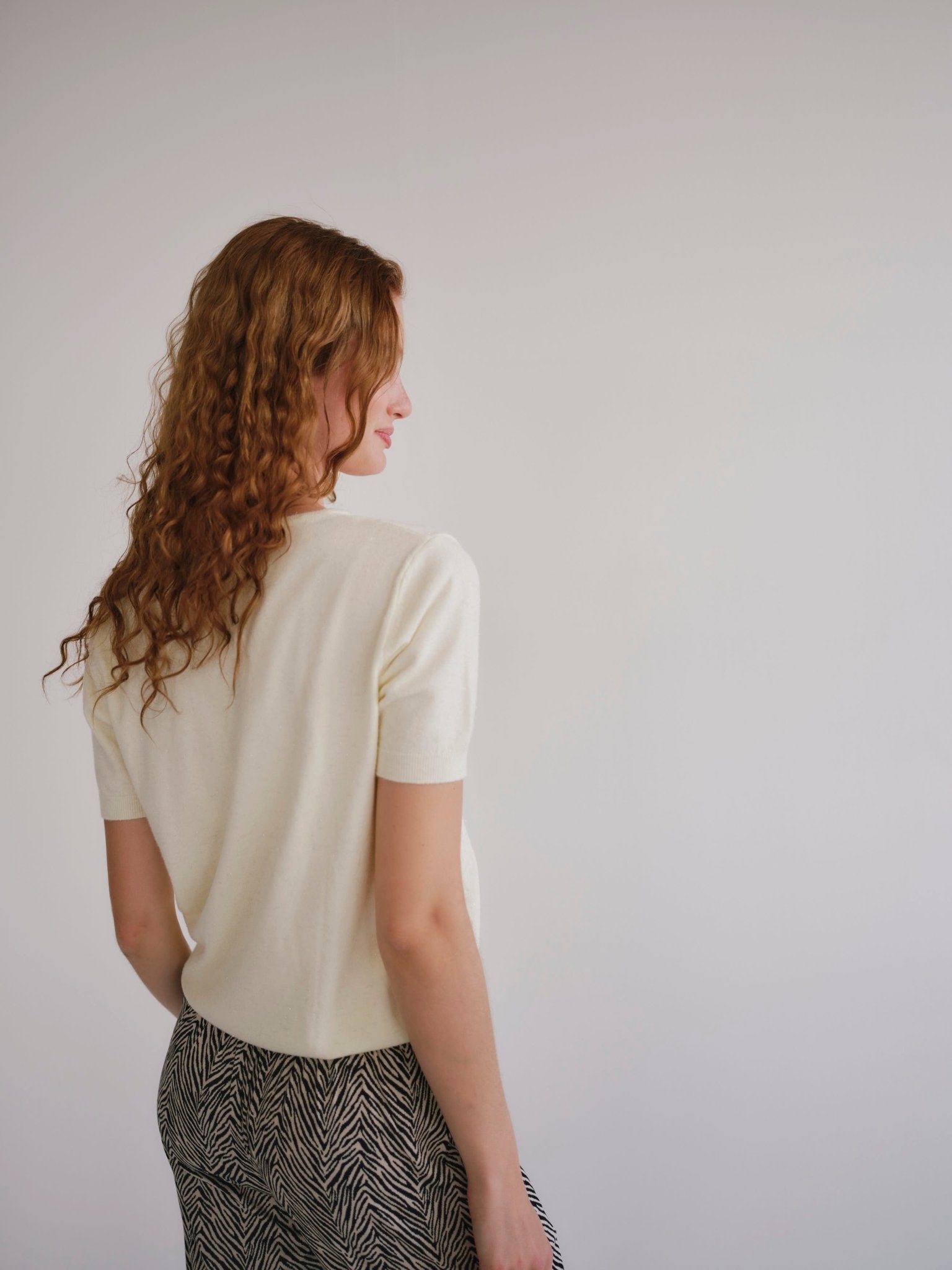 View our Lurex V Neck Tee with Shimmer Detail in Cream - by Tribute Store