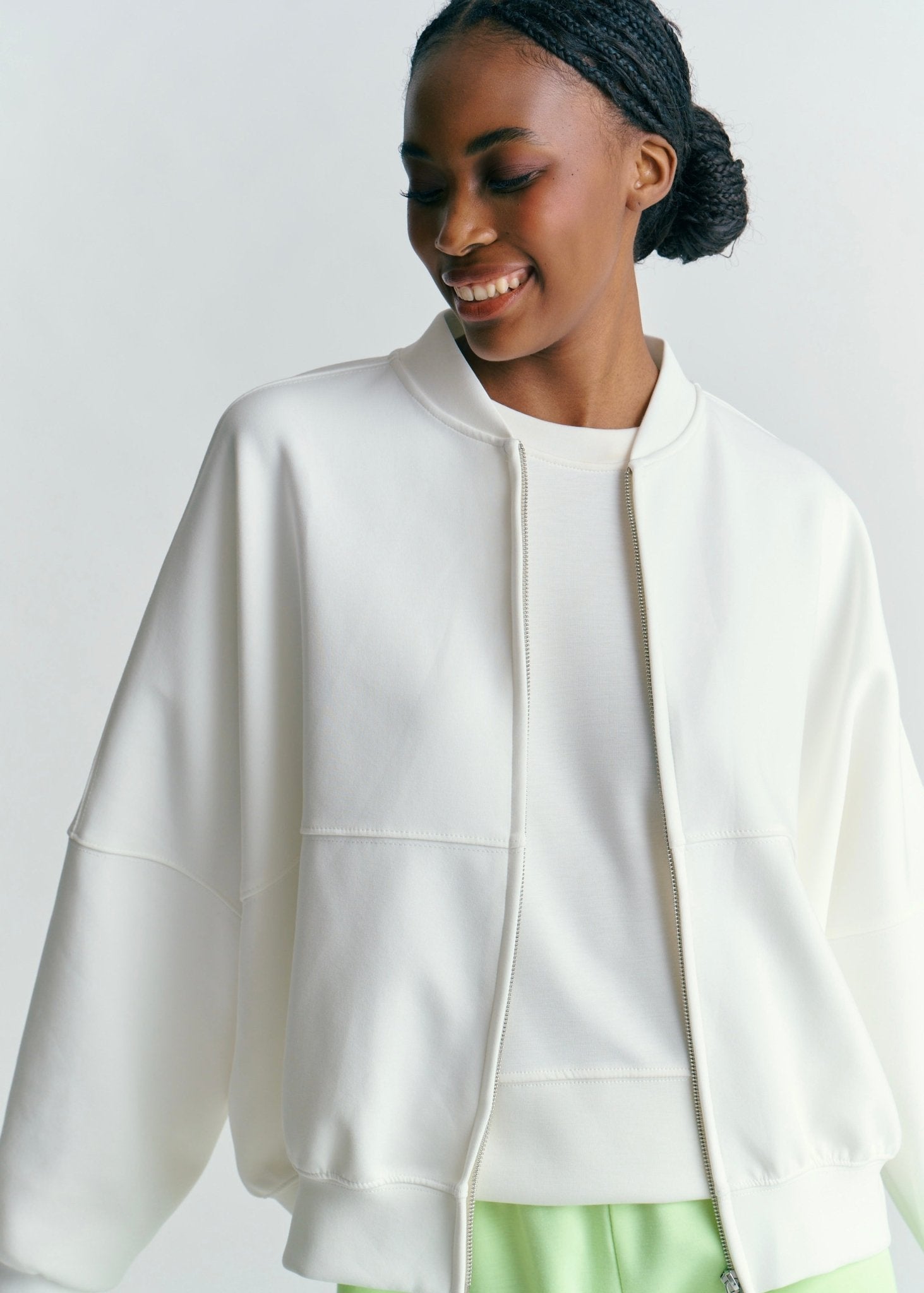View our Malmö Oversized Zip Up Bomber Jacket In White - by Tribute Store