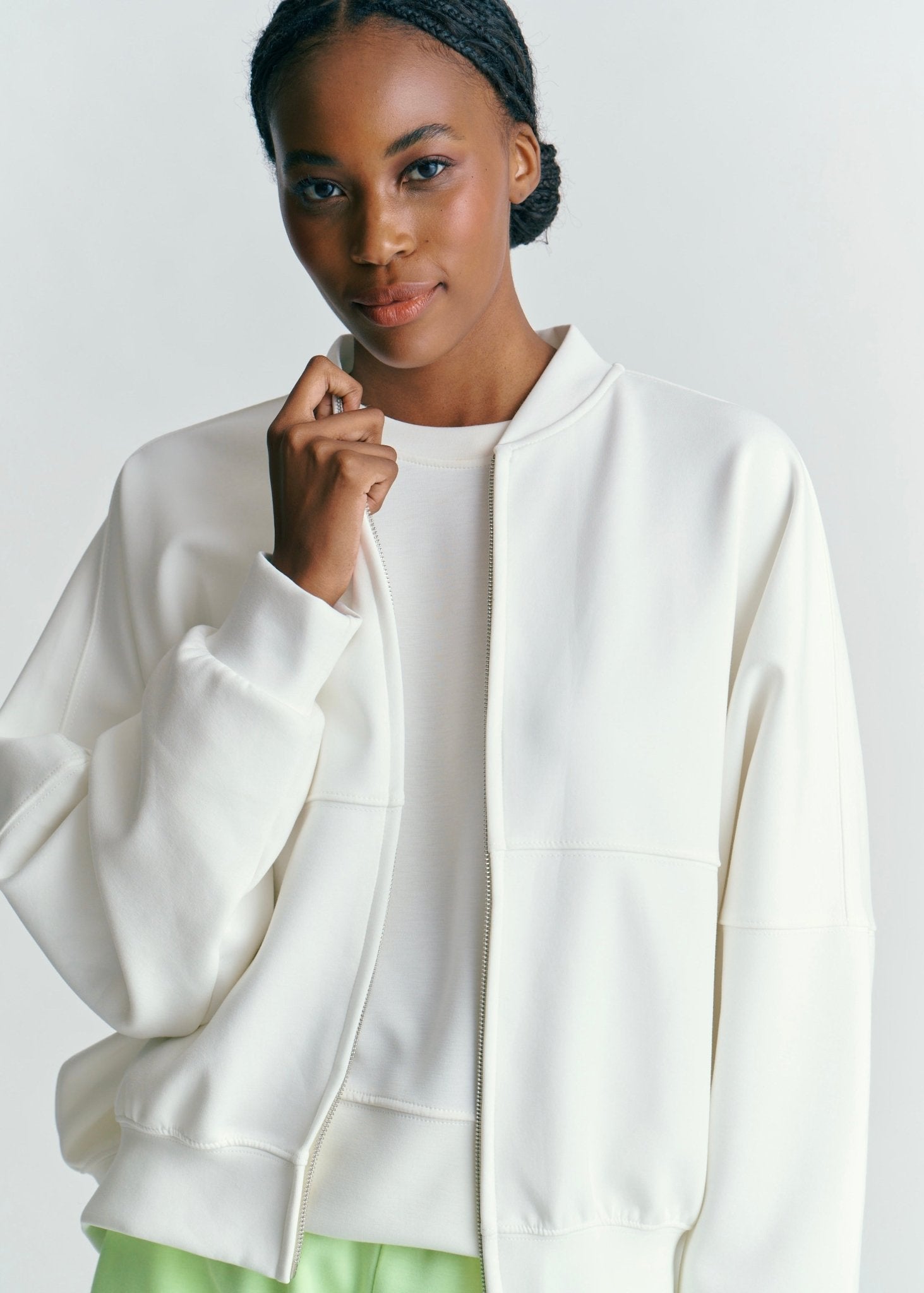 View our Malmö Oversized Zip Up Bomber Jacket In White - by Tribute Store