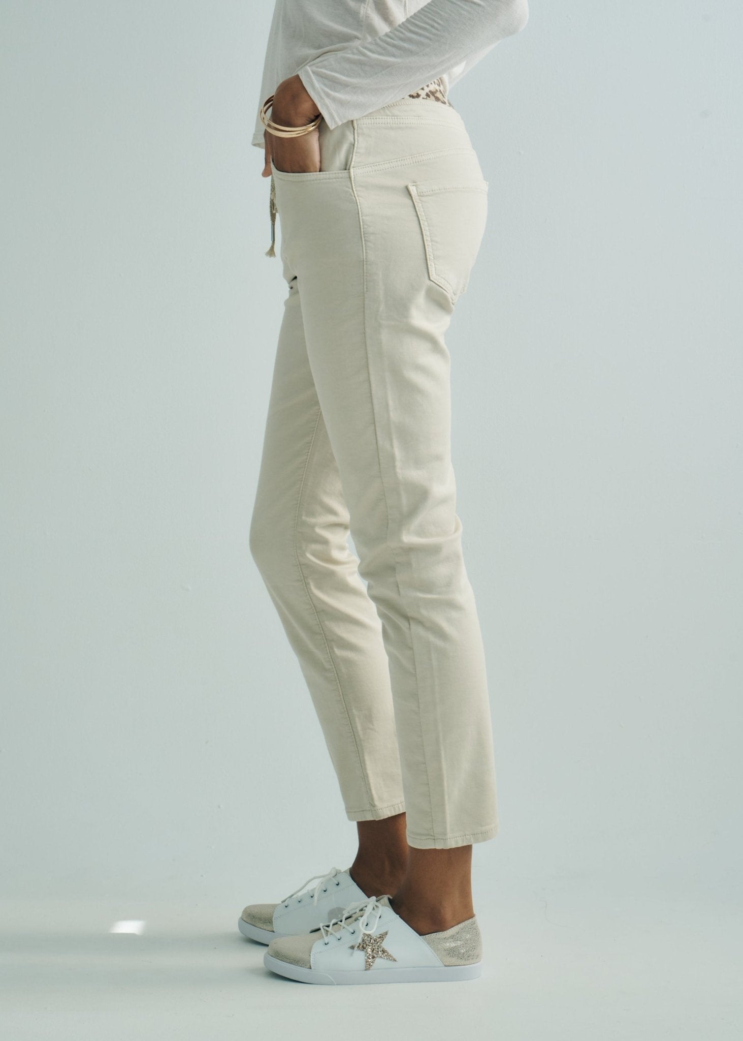 View our Mid - Rise Cotton Jogger Jeans in Beige with Animal Print Waist Band - by Tribute Store