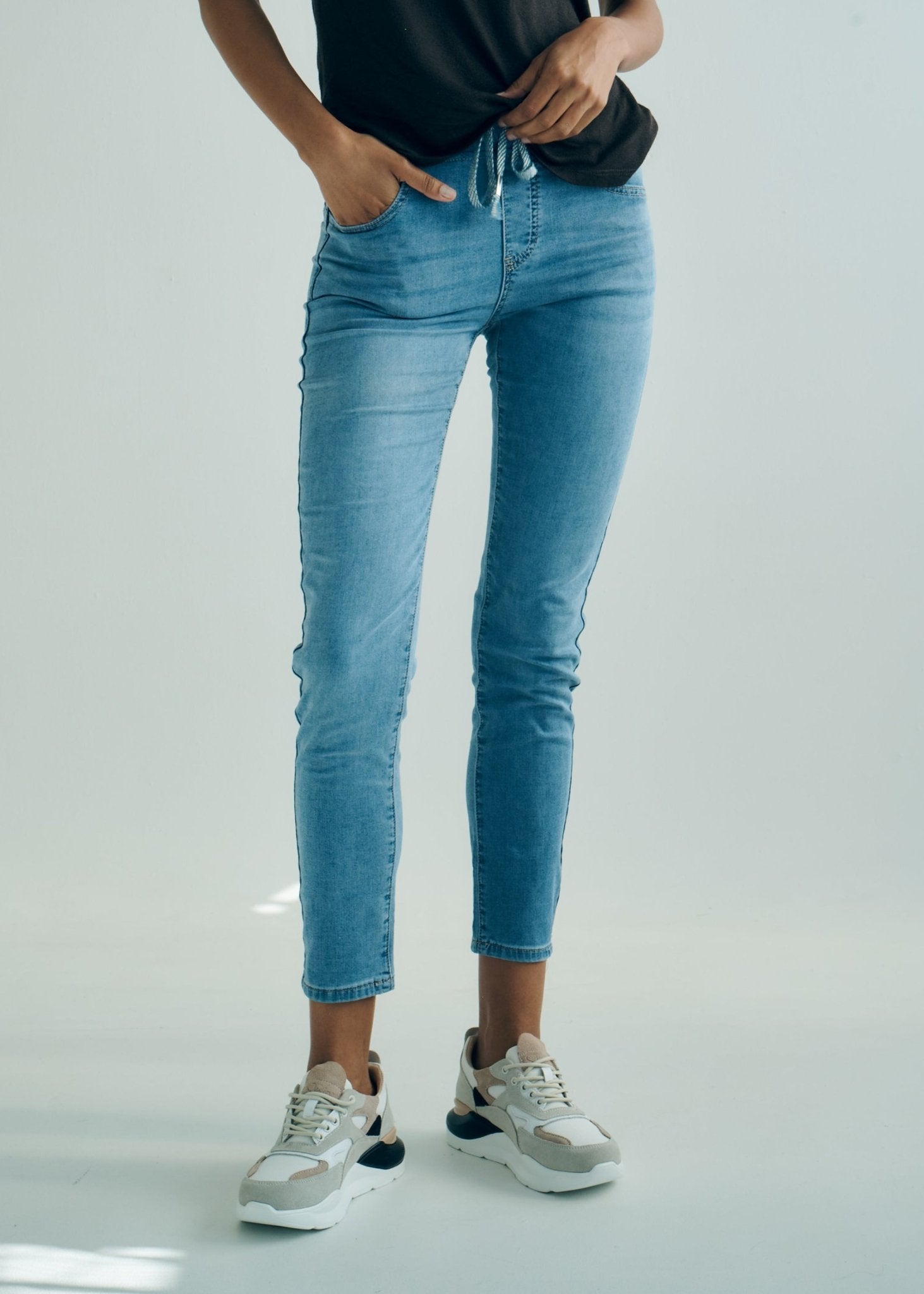 View our Mid - Rise Cotton Jogger Jeans in Blue with Animal Print Waist Band - by Tribute Store