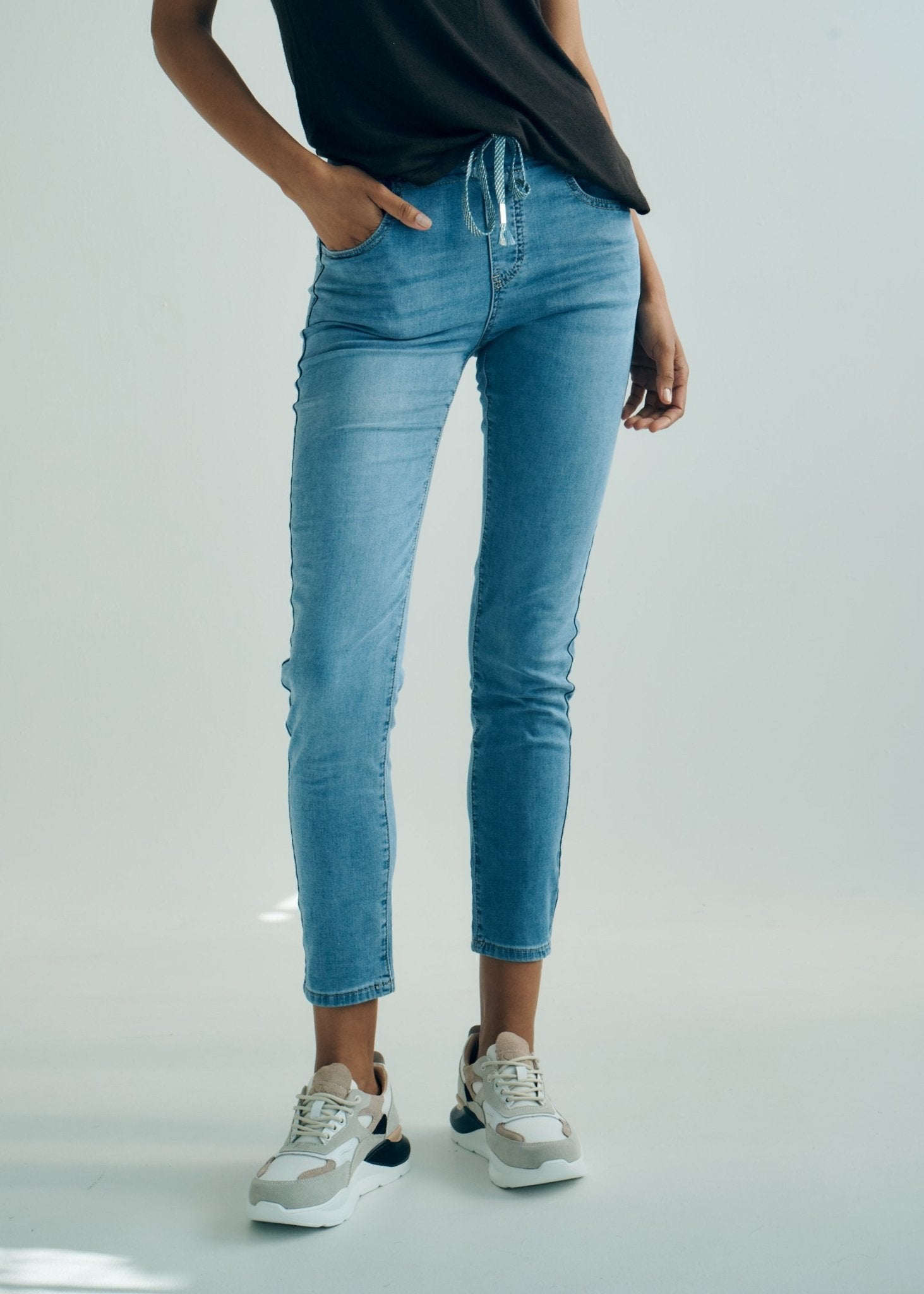 View our Mid - Rise Cotton Jogger Jeans in Blue with Animal Print Waist Band - by Tribute Store