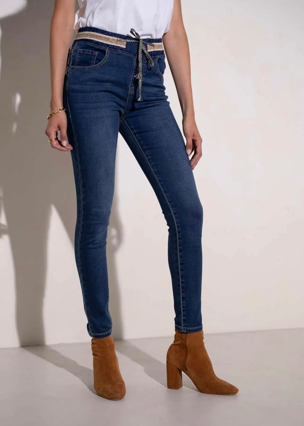 View our Mid - Rise Cotton Jogger Jeans in Blue with Gold Waist Band - by Tribute Store