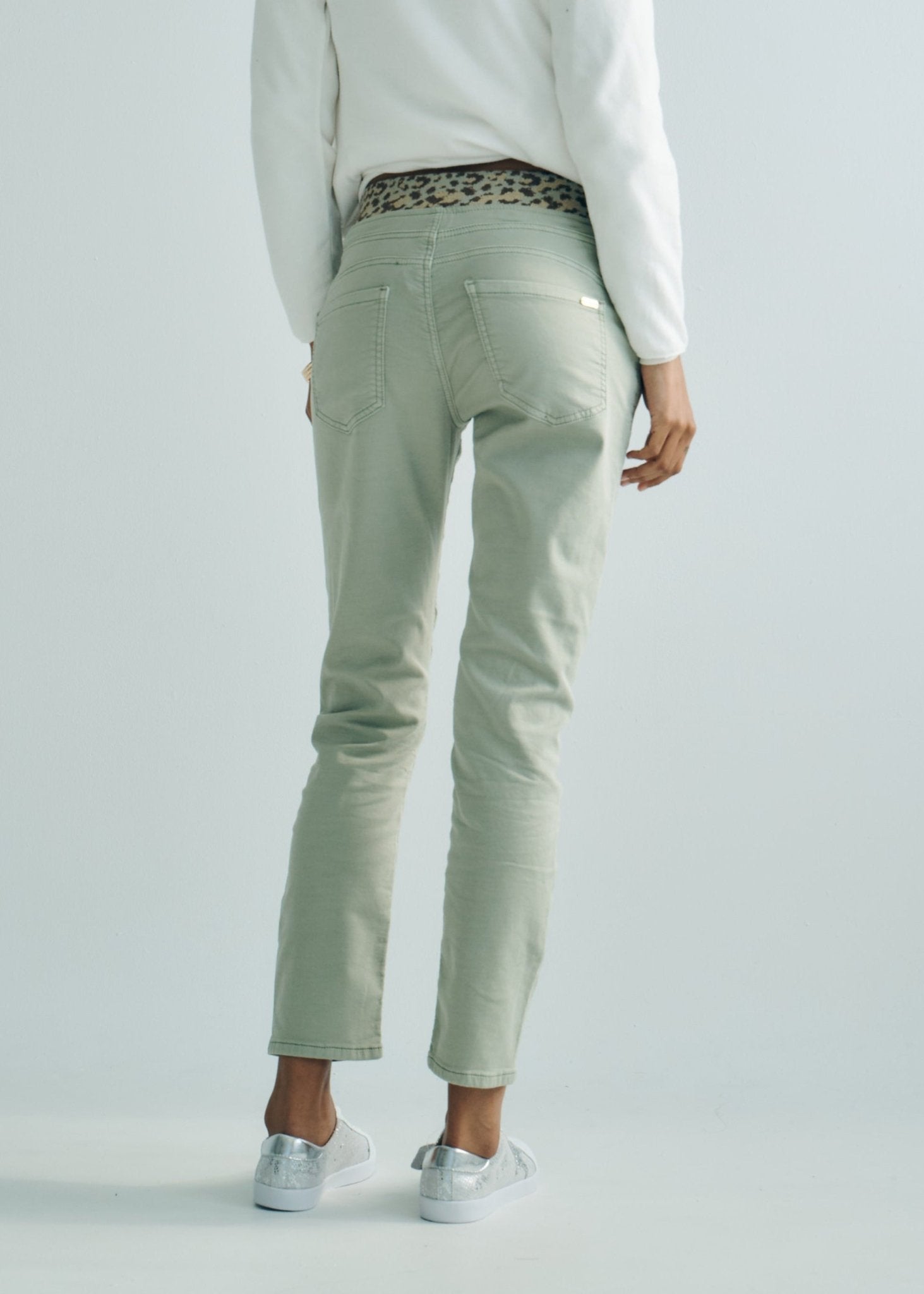 View our Mid - Rise Cotton Jogger Jeans in Khaki with Animal Print Waist Band - by Tribute Store