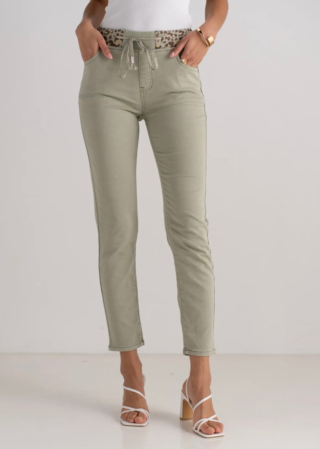 View our Mid - Rise Cotton Jogger Jeans in Khaki with Animal Print Waist Band - by Tribute Store