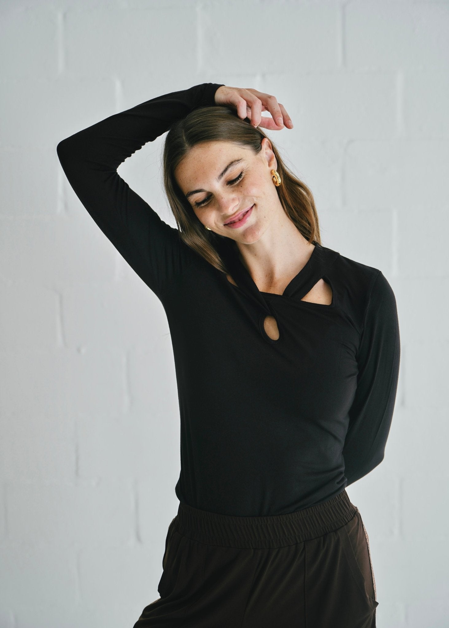View our Milla Twisted Cut - Out Long Sleeve Top Black - by Tribute Store