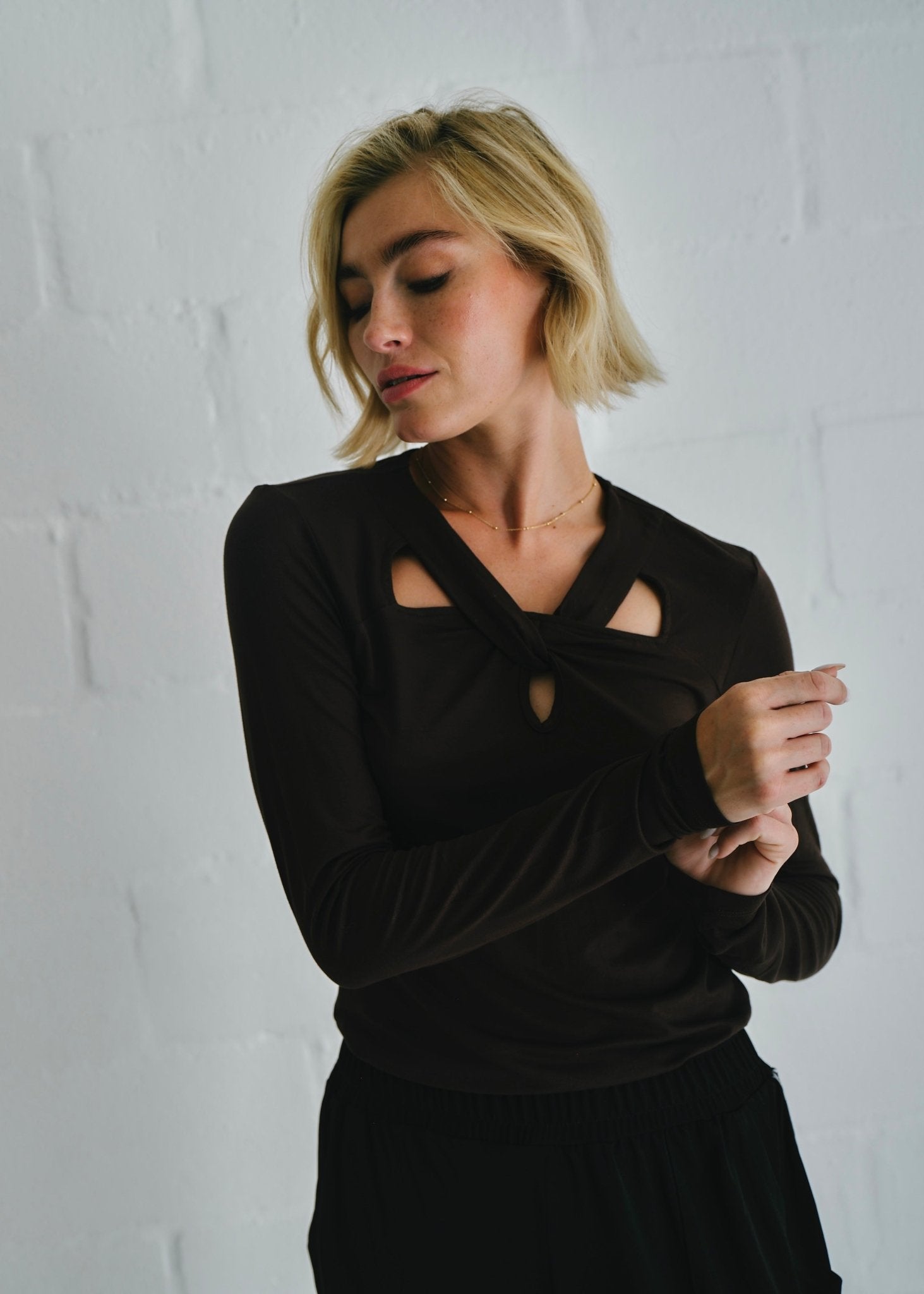 View our Milla Twisted Cut - Out Long Sleeve Top Brown - by Tribute Store