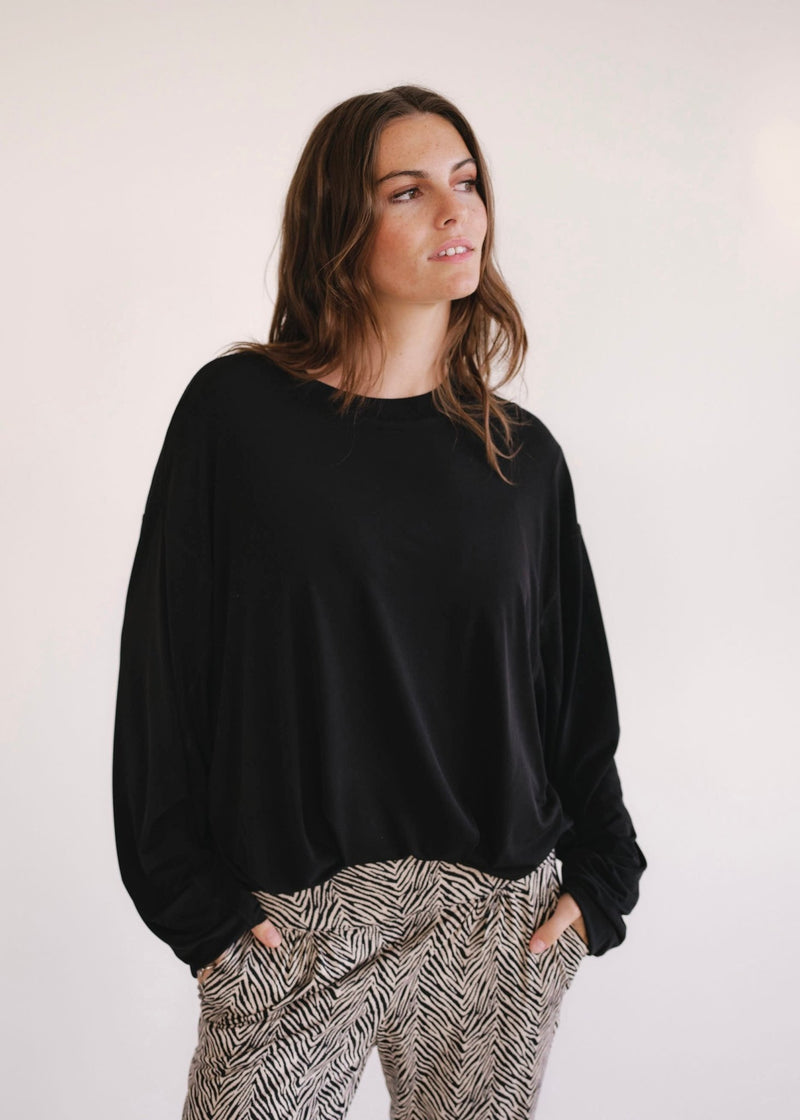 View our Oversized Batwing Top In Black - by Tribute Store