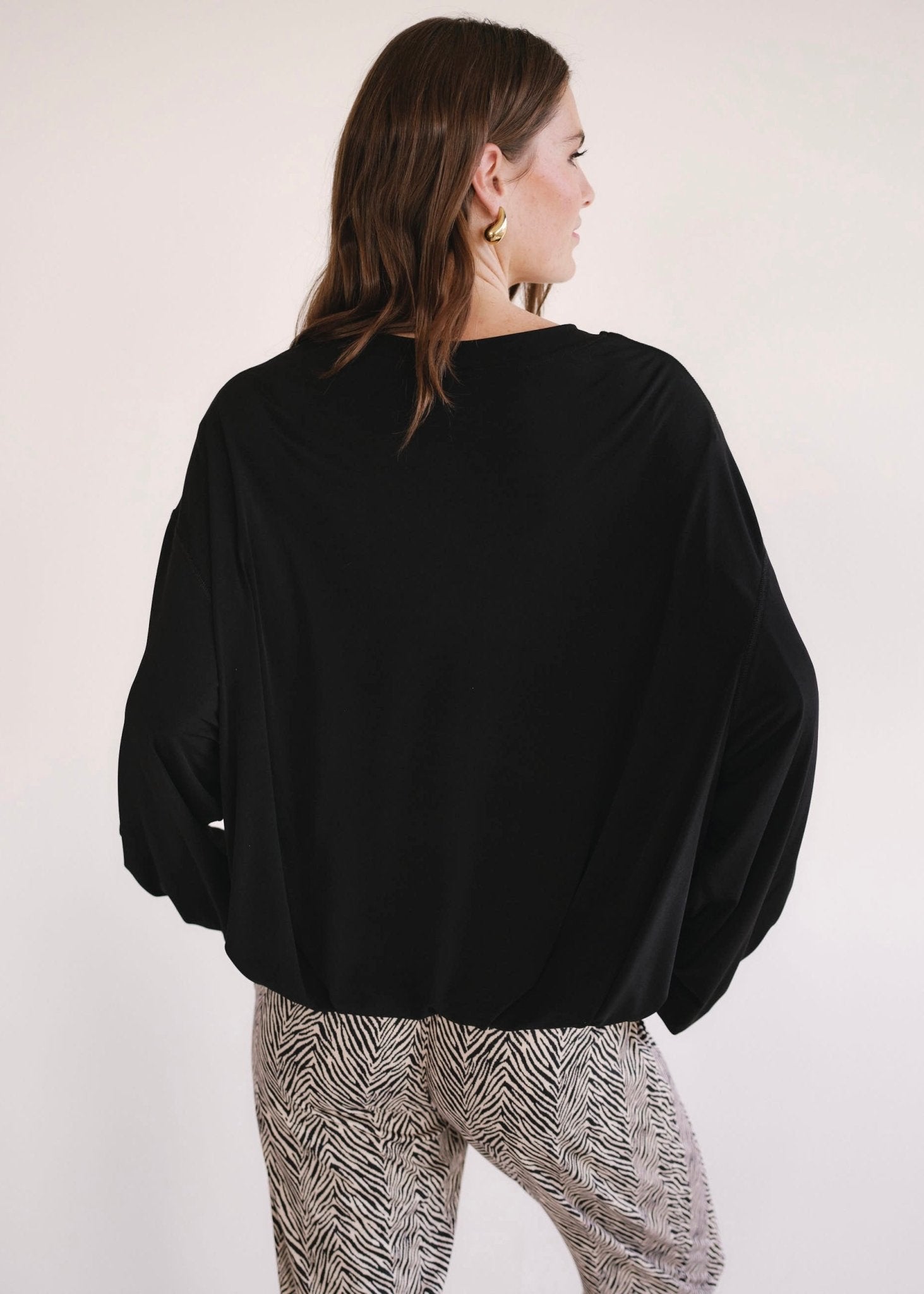View our Oversized Batwing Top In Black - by Tribute Store