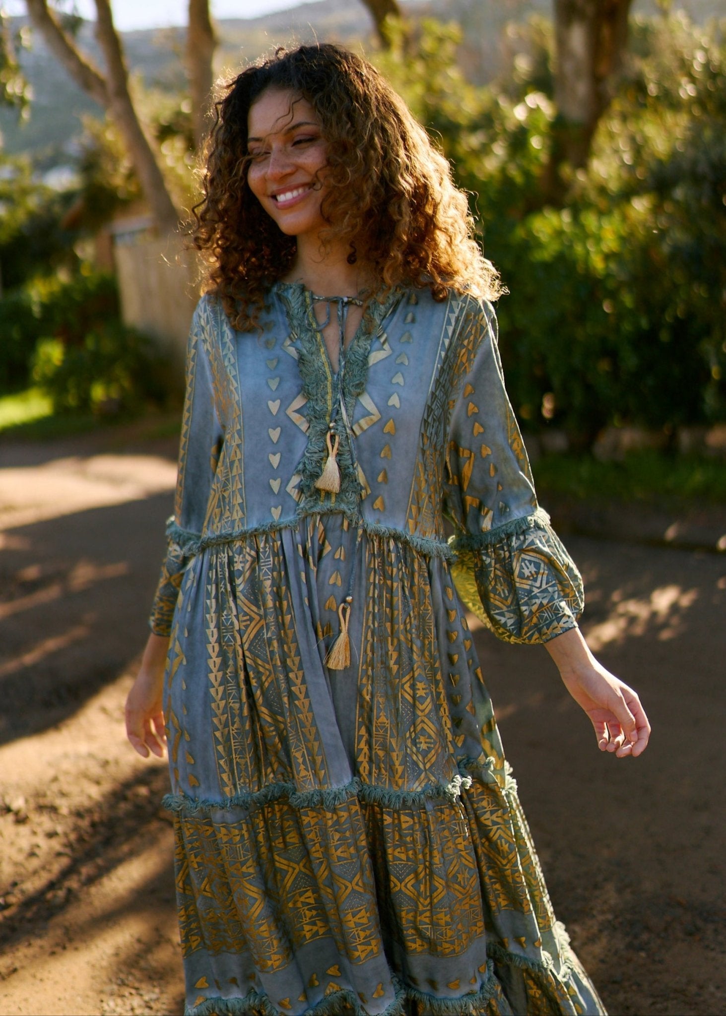 View our Phoebe Maxi Bohemian Dress with Front Tassels in Deep Green - by Tribute Store