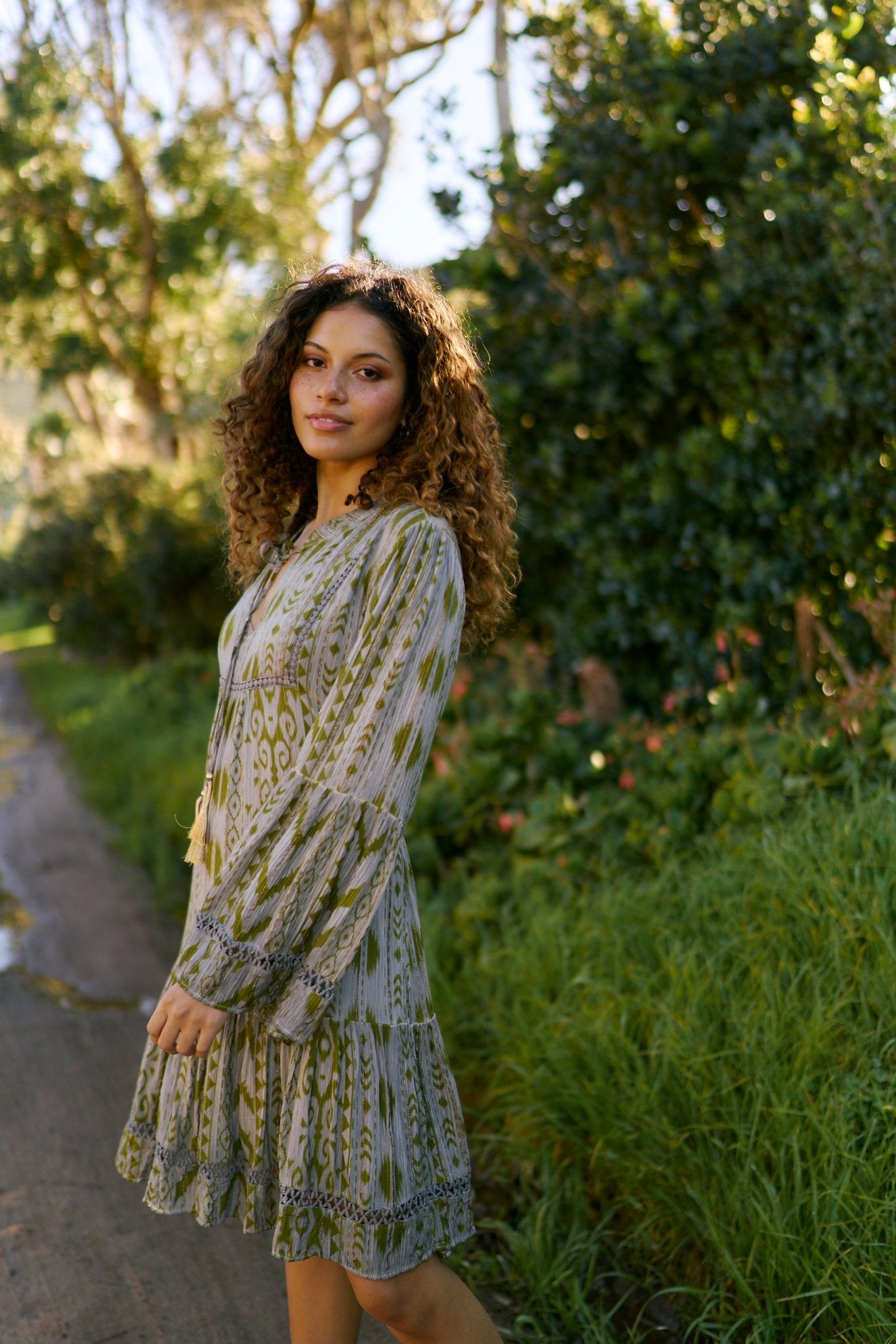 View our Phoebe Short Bohemian Dress with Tassels in Dark Green - by Tribute Store