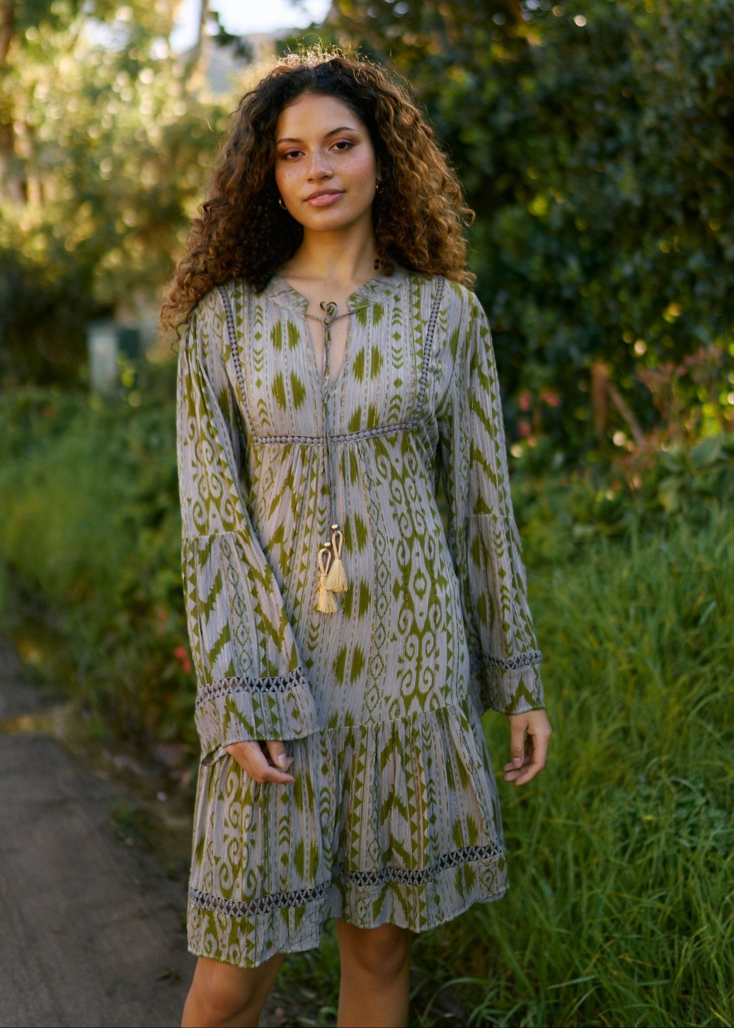 View our Phoebe Short Bohemian Dress with Tassels in Dark Green - by Tribute Store