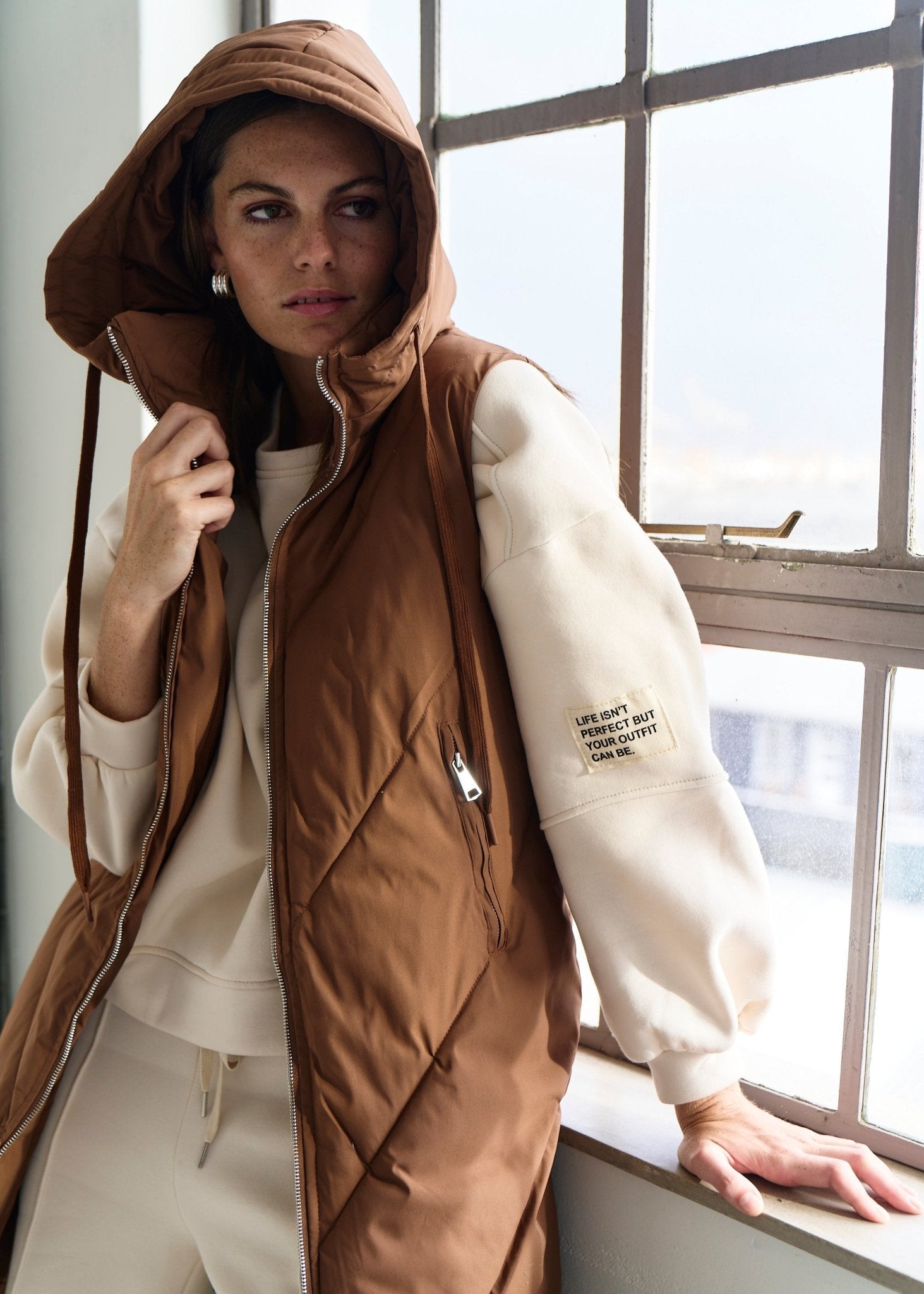 View our Scandi Sleeveless Down Feather Winter Puffer Jacket in Coffee - by Tribute Store