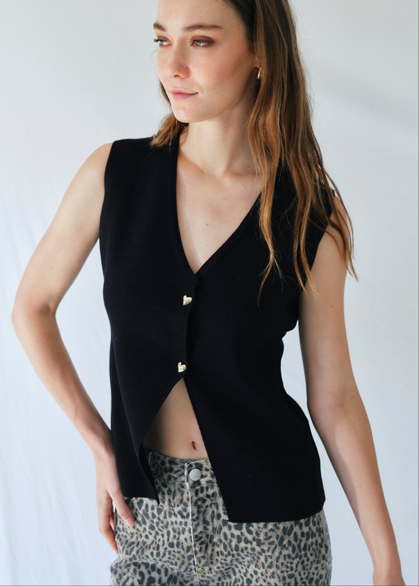 View our Sleeveless Knitted Cardi with Gold Heart Buttons in Black - by Tribute Store