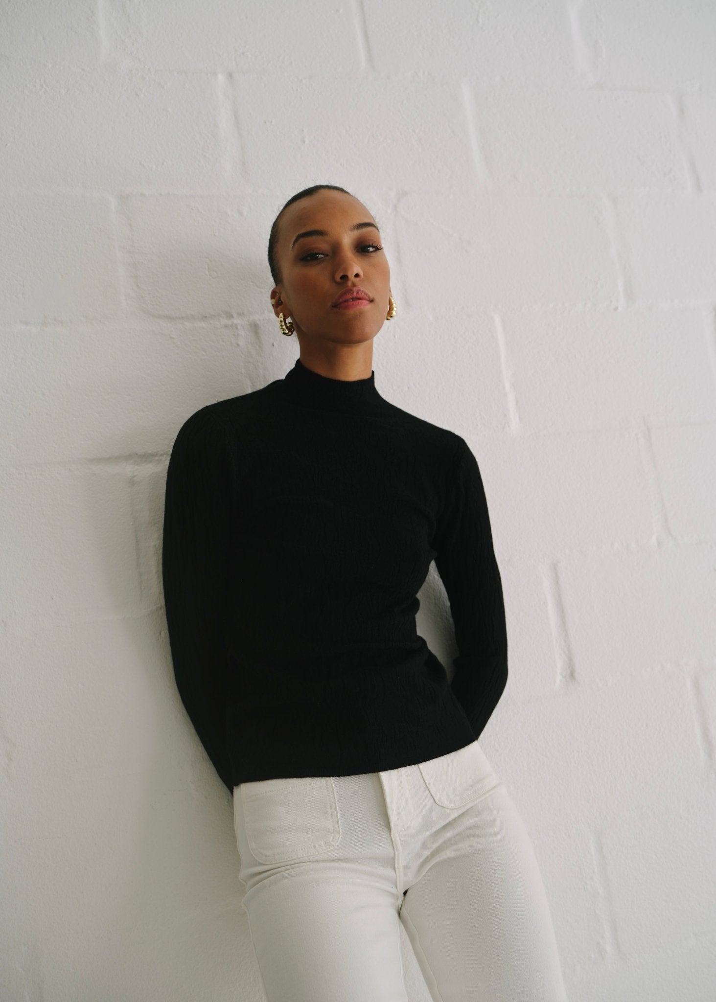 View our The Essential Black Embossed Turtleneck Knit - by Tribute Store