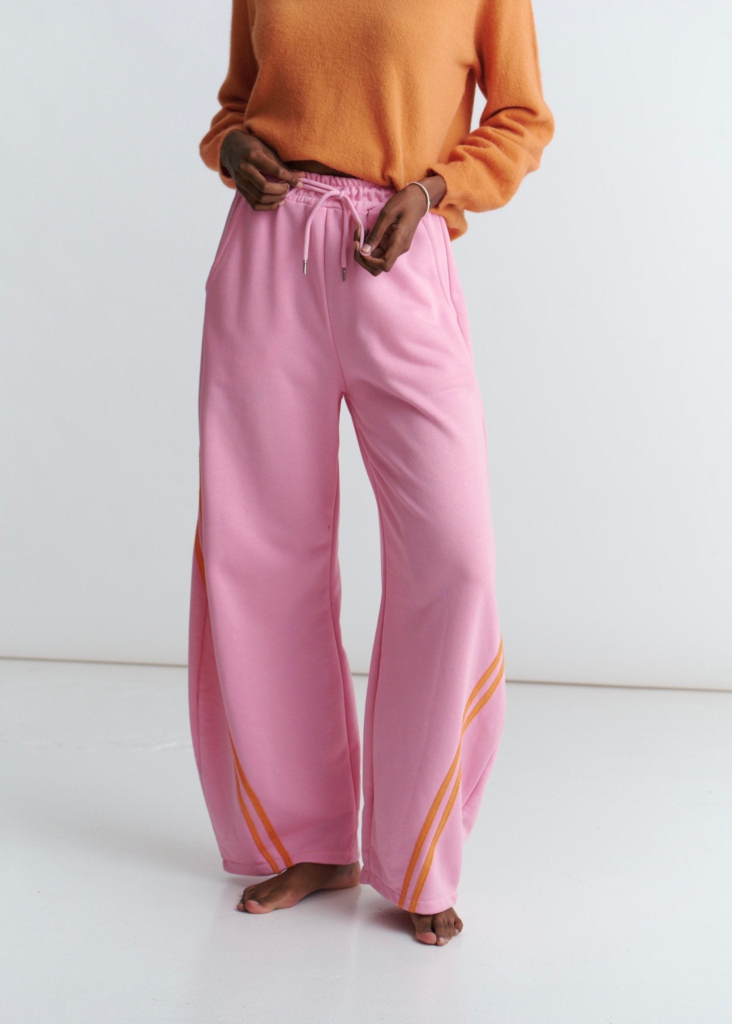 View our Tribeca Italian Cotton Barrel Track Pants In Pink and Orange - by Tribute Store