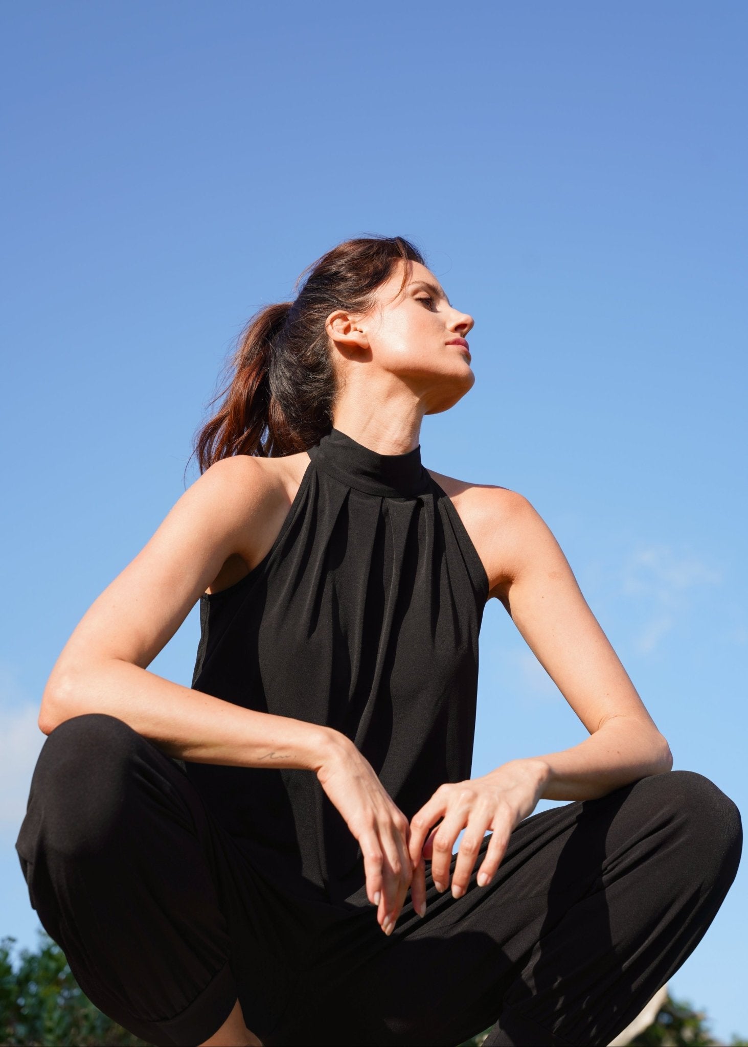 View our Zarah Halterneck Jumpsuit in Black - by Tribute Store